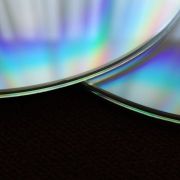 two dvds on a black background